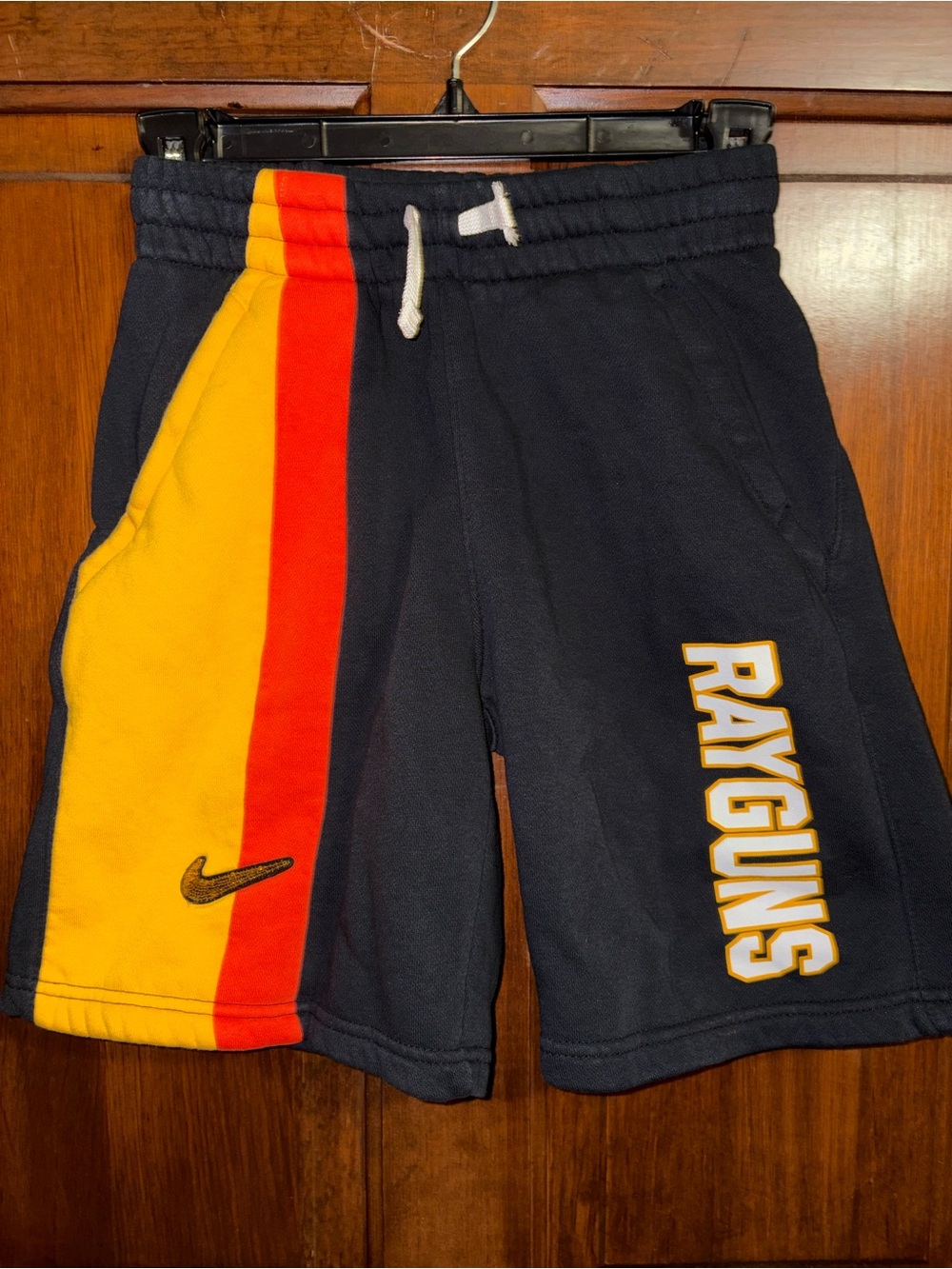 Nike Navy Shorts with Yellow and Red Side Stripes